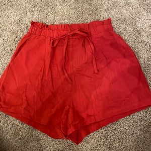 Red flowy shorts.
